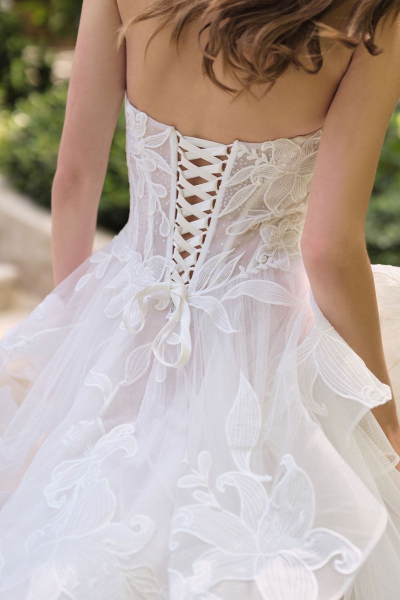 Star Lily floral design atop layered tulle