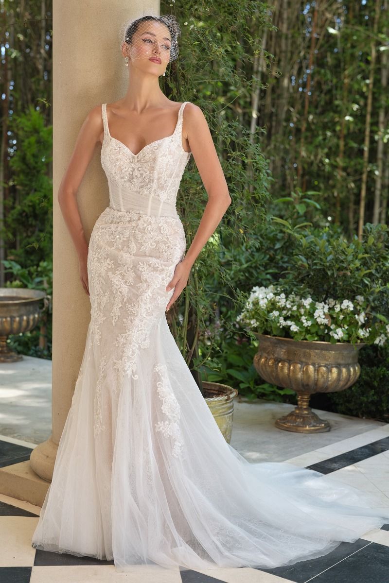 Embroidered lace overlay with tulle draping and soft train