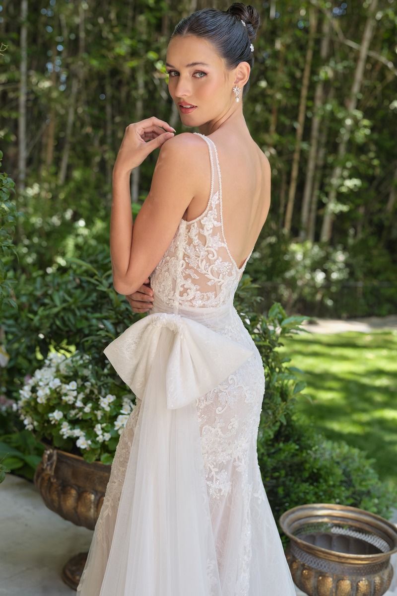 Embroidered lace overlay with tulle draping and soft train