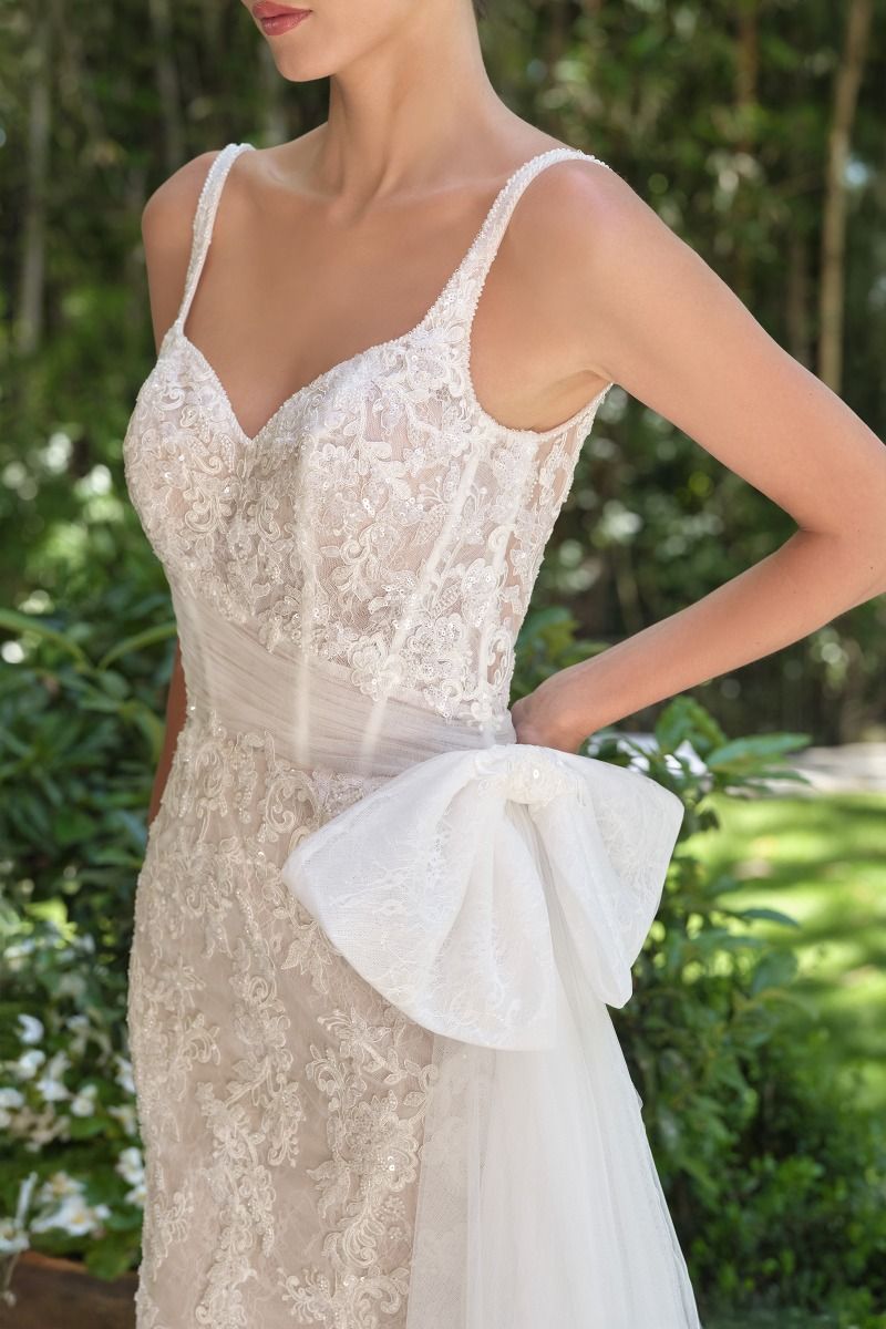 Embroidered lace overlay with tulle draping and soft train