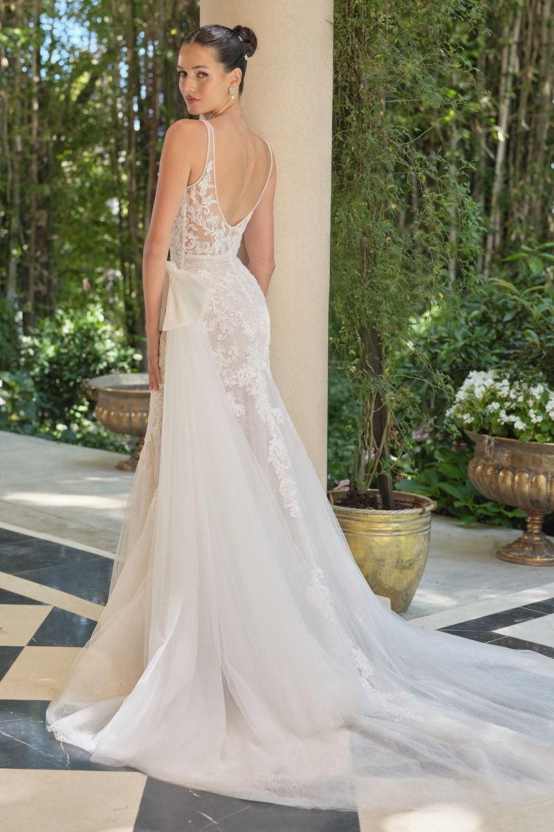 Embroidered lace overlay with tulle draping and soft train