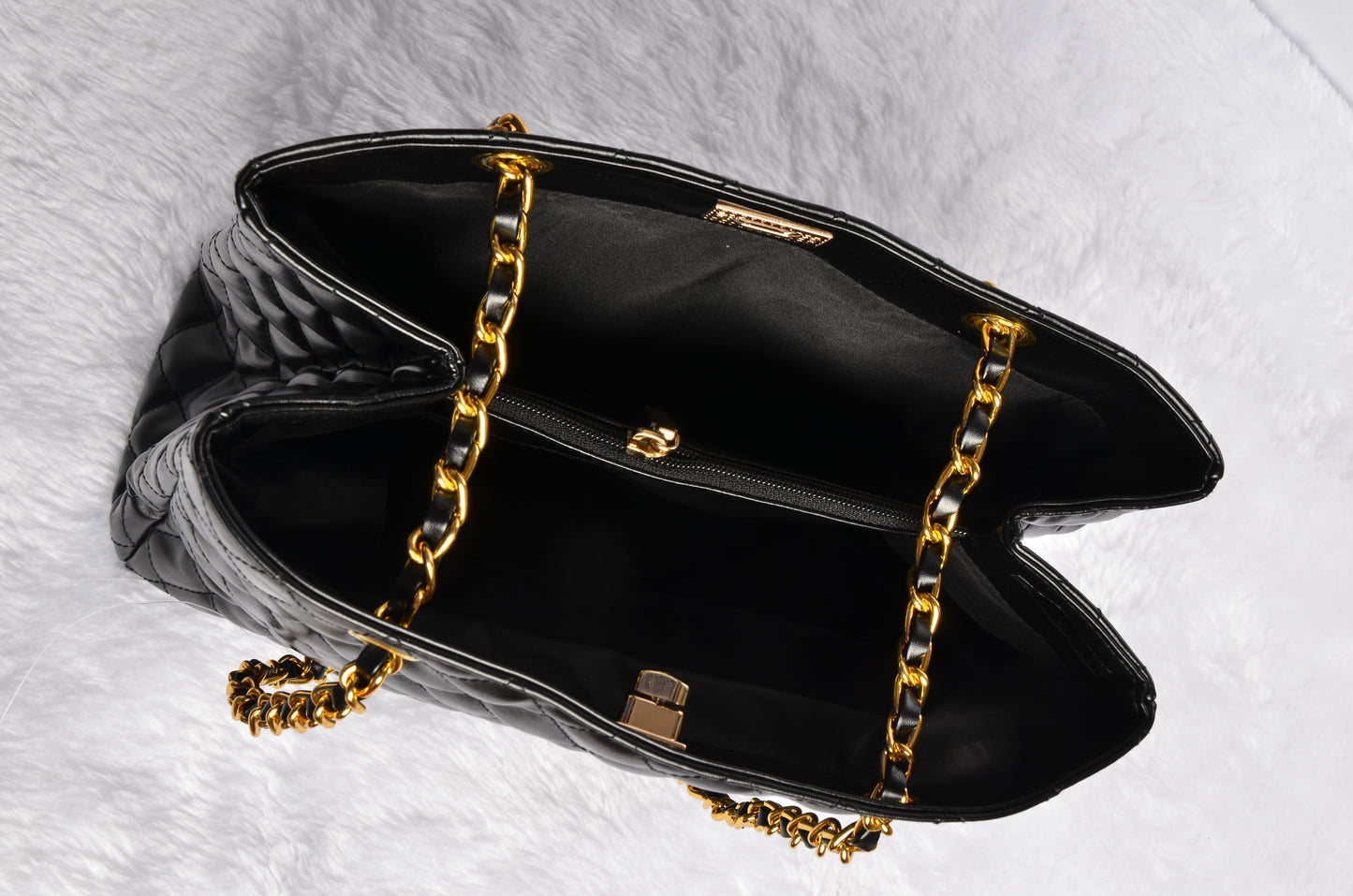 Stylish handbag with gold chain strap